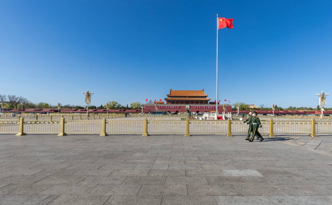 Tiananmen in Beijing, China. The Covid 19 virus rages, and Armed police soldiers patrolling Tiananmen Square wearing N95 masks.