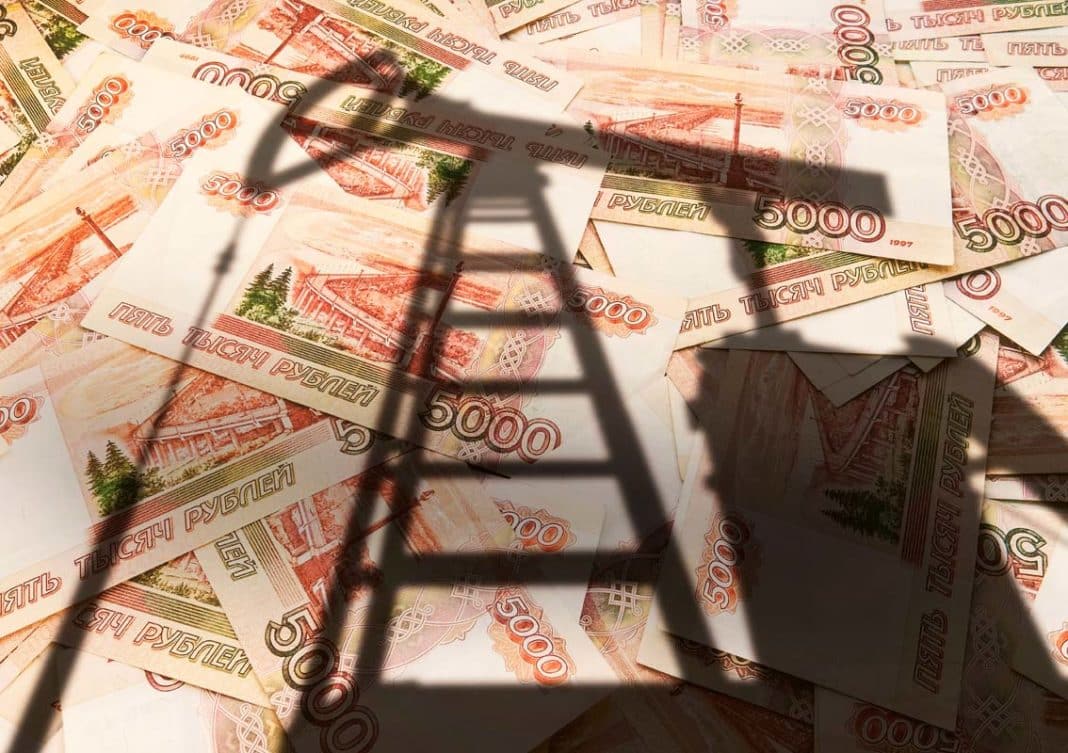 concept of selling minerals for Russian rubles. The shadow of the oil rig against the background of Russian money. Earn money from mining gas and oil energy resources